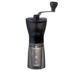 HARIO | Compact & Adjustable Hand Coffee Grinder With Burrs, Transparent Black   | Macinacaffè manuale compatto e regolabile con frese in ceramica, nero trasparente, plastica